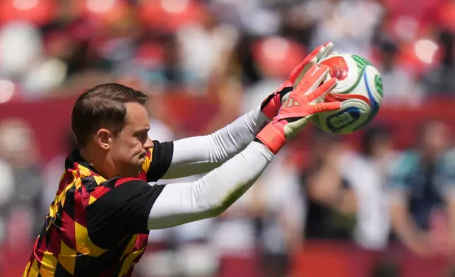 Germany goalkeeper Manuel Neuer takes part in the warm up ahead of the World Cup Group E soccer match between Germany and Ivory Coast in Toronto, Saturday, June 20, 2026. (AP Photo/Stephanie Scarbrough)