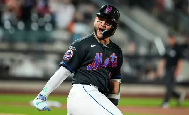 New York Mets' Bo Bichette (19) celebrates a solo home run during the second inning of a baseball game against the Atlanta Braves, Friday, June 12, 2026, in New York. (AP Photo/Eduardo Munoz Alvarez)