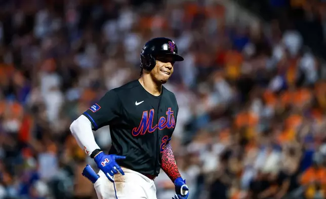 New York Mets' Juan Soto celebrates after his solo home run during first inning of a baseball game against the Atlanta Braves, Friday, June 12, 2026, in New York. (AP Photo/Eduardo Munoz Alvarez) CORRECTION: Corrects to Atlanta Braves not St. Louis Cardinals.