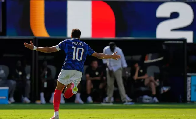 France's Kylian Mbappe (10) celebrates after scoring their third goal during the World Cup Group I soccer match between France and Senegal in East Rutherford, N.J., near New York, Tuesday, June 16, 2026. (AP Photo/Steve Luciano)