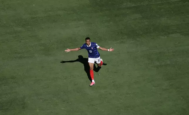 France's Kylian Mbappe celebrates after scoring third goal during the World Cup Group I soccer match between France and Senegal in East Rutherford, N.J., near New York, Tuesday, June 16, 2026. (AP Photo/Adam Hunger)