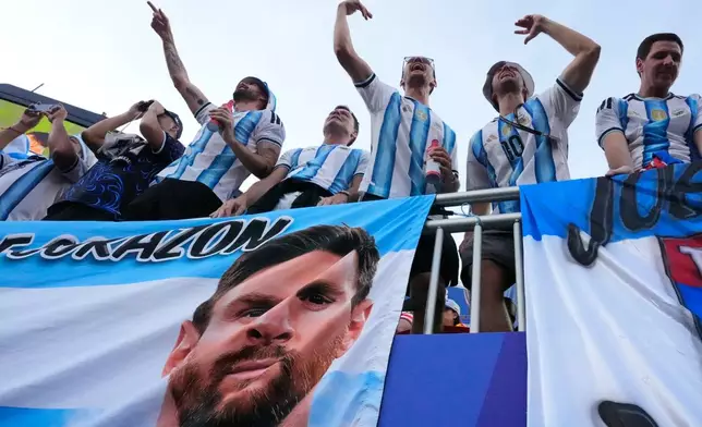 Argentinian fans react ahead of the World Cup Group J soccer match between Argentina and Algeria in Kansas City, Mo., Tuesday, June 16, 2026. (AP Photo/Charlie Riedel)