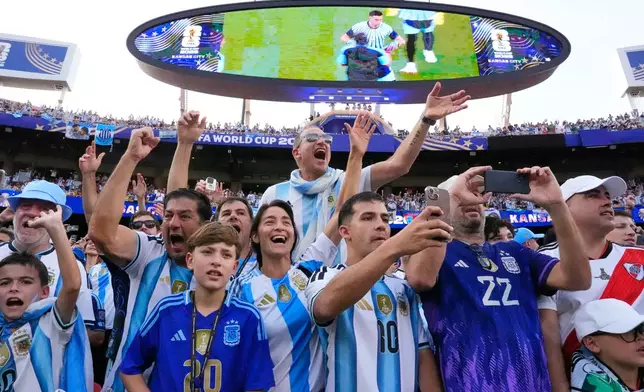 Argentinian fans react ahead of the World Cup Group J soccer match between Argentina and Algeria in Kansas City, Mo., Tuesday, June 16, 2026. (AP Photo/Charlie Riedel)