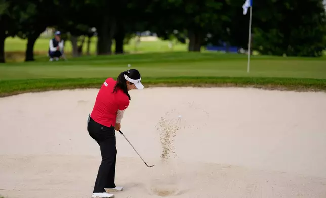 Ina Yoon, of South Korea, hits from a bunker on the second hole during the first round of the Women's PGA Championship golf tournament, Friday, June 25, 2026, in Chaska, Minn. (AP Photo/Chris Carlson)