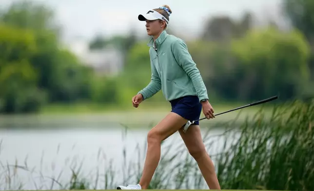 Nelly Korda walks onto the 16th green during the first round of the Women's PGA Championship golf tournament, Thursday, June 25, 2026, in Chaska, Minn. (AP Photo/Matt York)
