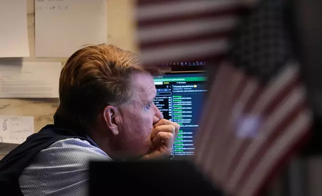 Trader John Bowers works on the floor of the New York Stock Exchange, Wednesday, June 3, 2026. (AP Photo/Richard Drew)