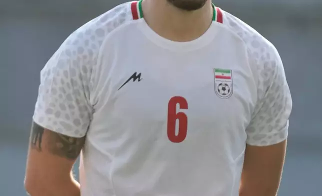 Iran's Saeid Ezatolahi listens to national anthems prior to a friendly soccer match between Iran and Gambia, in Antalya, southern Turkey, Friday, May 29, 2026. (AP Photo/Khalil Hamra)