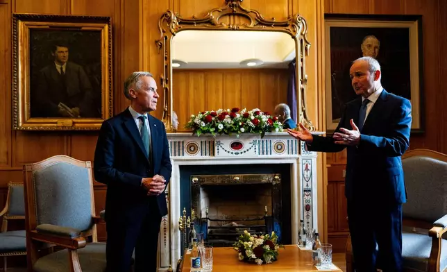 Prime Minister Mark Carney, left, speaks with Micheal Martin, Ireland's head of government, at the Government Buildings in Dublin, on Saturday, June 13, 2026. (Christopher Katsarov /The Canadian Press via AP)