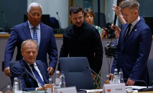 Ukraine's President Volodymyr Zelenskyy, second right, greets Hungary's Prime Minister Peter Magyar, right, next to European Council President Antonio Costa during a round table meeting at the EU summit in Brussels, Thursday, June 18, 2026. (AP Photo/Geert Vanden Wijngaert, Pool)