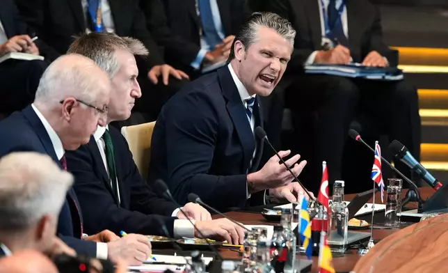 United States Defense Secretary Pete Hegseth, right, speaks during a meeting of the North Atlantic Council in defense ministers format at NATO headquarters in Brussels, Thursday, June 18, 2026. (AP Photo/Virginia Mayo)