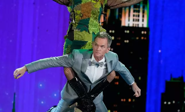 Host Pink, left, and Neil Patrick Harris perform during the 79th Tony Awards on Sunday, June 7, 2026, at Radio City Music Hall in New York. (Photo by Charles Sykes/Invision/AP)