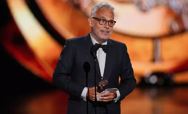 Joe Mantello accepts the award for best direction of a play for "Death of a Salesman" during the 79th Tony Awards on Sunday, June 7, 2026, at Radio City Music Hall in New York. (Photo by Charles Sykes/Invision/AP)