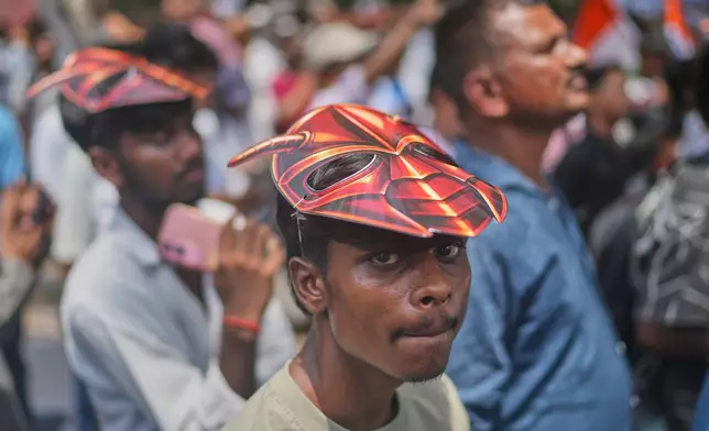 Supporters of the Cockroach Janta Party wear masks during a protest demonstration demanded the resignation of Education Minister Dharmendra Pradhan over alleged examination irregularities and repeated paper leaks in New Delhi, India, Saturday, June 20, 2026. (AP Photo/Manish Swarup)