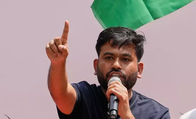 Abhijeet Dipke, founder of the Cockroach Janta Party addresses supporters during a protest demanding the resignation of Education Minister Dharmendra Pradhan over alleged examination irregularities and repeated paper leaks in New Delhi, India, Saturday, June 20, 2026. (AP Photo/Manish Swarup)