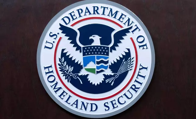FILE - The seal of U.S. Department of Homeland Security is seen before a news conference at ICE Headquarters in Washington, May 21, 2025. (AP Photo/Jose Luis Magana, File)
