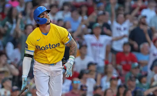 Boston Red Sox's Jarren Duran watches his eighth-inning two-run home run during a baseball game against the Texas Rangers, Saturday, June 13, 2026, in Boston. (AP Photo/Jim Davis)