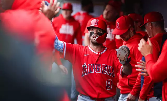 Los Angeles Angels' Zach Neto celebrates after scoring in the first inning of a baseball game against the Seattle Mariners, Monday, June 29, 2026, in Seattle. (AP Photo/Kevin Ng)