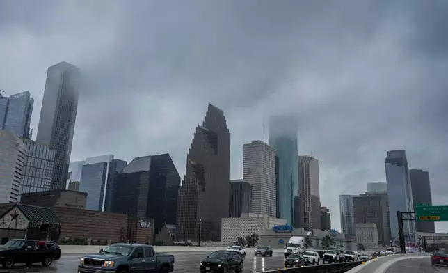 Low clouds hang over downtown produced by tropical weather in the Gulf of Mexico in Houston, Wednesday, June 17, 2026. 9Brett Coomer/Houston Chronicle via AP)