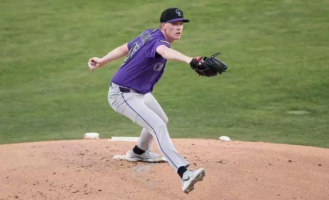 Colorado Rockies starting pitcher Sean Sullivan (45) throws during the first inning of a baseball game against the Athletics, Friday, June 12, 2026, in Las Vegas. (AP Photo/Caroline Brehman)