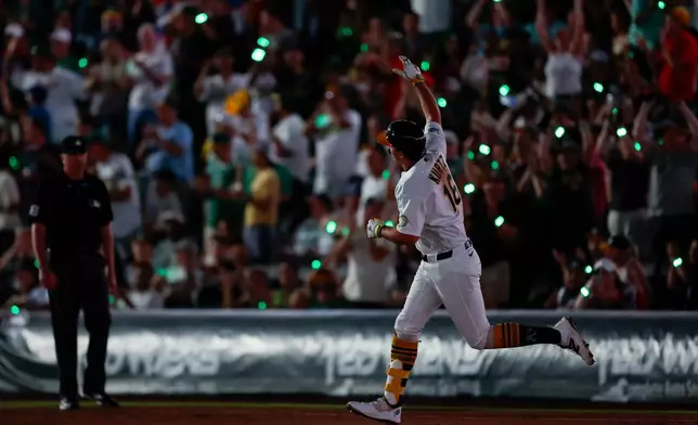 Athletics' Nick Kurtz (16) rounds the bases after hitting a solo home run during the fifth inning of a baseball game against the Colorado Rockies, Friday, June 12, 2026, in Las Vegas. (AP Photo/Caroline Brehman)