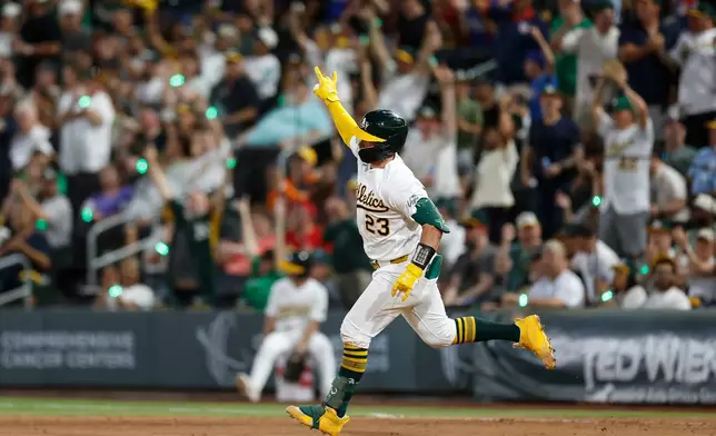 Athletics' Shea Langeliers (23) rounds the bases after hitting a solo home run during the fifth inning of a baseball game against the Colorado Rockies, Friday, June 12, 2026, in Las Vegas. (AP Photo/Caroline Brehman)