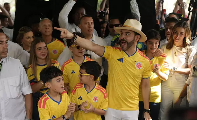 Presidential candidate Abelardo de la Espriella of the opposition Defenders of the Motherland movement arrives to vote with his family during the runoff election in Barranquilla, Colombia, Sunday, June 21, 2026. (AP Photo/Ivan Valencia)