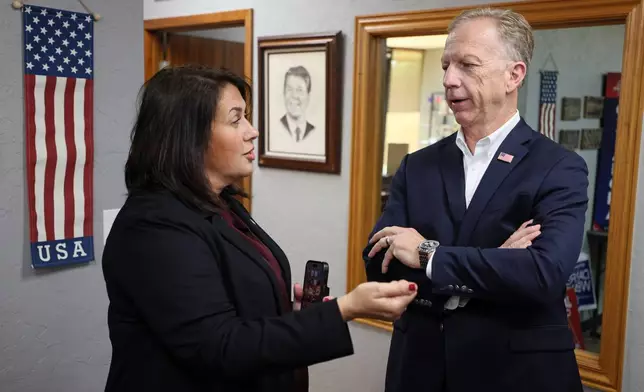 Oklahoma Republican Party chair Charity Linch, left, and Rep. Kevin Hern, candidate for U.S. Senate, speak at the state GOP headquarters, Tuesday, June 16, 2026, in Oklahoma City. (AP Photo/Nate Billings)