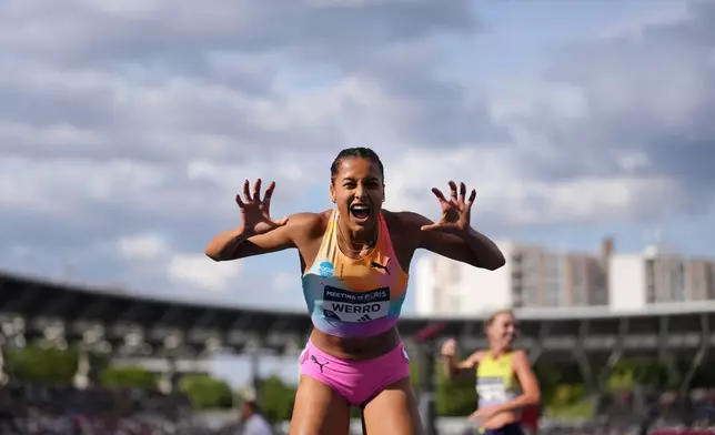 Audrey Werro, of Switzerland, poses after winning the women's 800 meters at the Meeting de Paris Diamond League athletics meet in Paris, Sunday, June 28, 2026. (AP Photo/Aurelien Morissard)