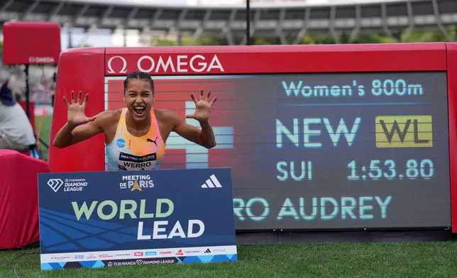 Audrey Werro, of Switzerland, poses after winning the women's 800 meters at the Meeting de Paris Diamond League athletics meet in Paris, Sunday, June 28, 2026. (AP Photo/Aurelien Morissard)