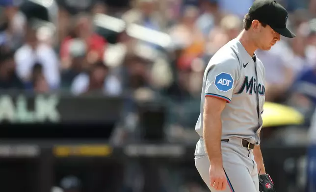Miami Marlins pitcher Josh White walks back to the mound during the sixth inning of a baseball game against the New York Mets, Sunday, May 31, 2026, in New York. (AP Photo/Heather Khalifa)