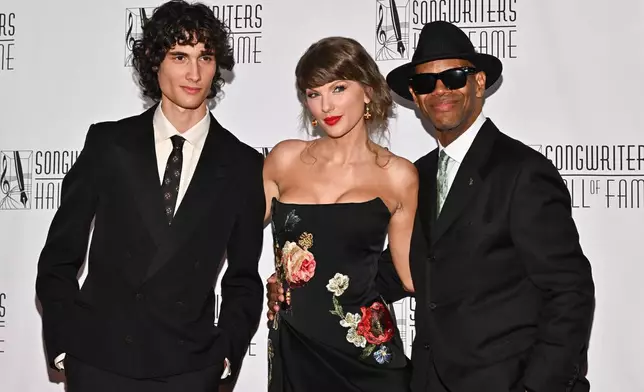 Sombr, from left, Taylor Swift, and Jimmy Jam attend the 55th annual Songwriters Hall of Fame Induction and Awards Gala at the Marriott Marquis Hotel on Thursday, June 11, 2026, in New York. (Photo by Evan Agostini/Invision/AP)