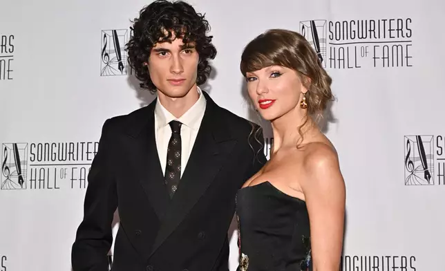 Sombr, left, and Taylor Swift attend the 55th annual Songwriters Hall of Fame Induction and Awards Gala at the Marriott Marquis Hotel on Thursday, June 11, 2026, in New York. (Photo by Evan Agostini/Invision/AP)