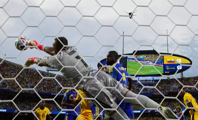 Curaçao goalkeeper Eloy Room (1) makes a save during the World Cup Group E soccer match between Ecuador and Curacao in Kansas City, Mo., Saturday, June 20, 2026. (AP Photo/Ed Zurga)