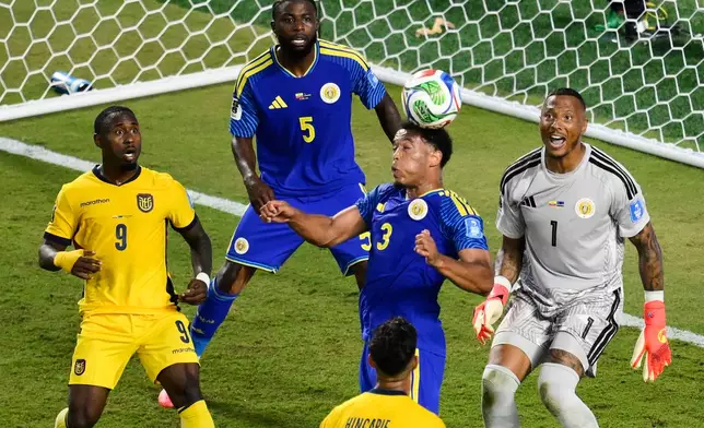 Curaçao's Jurien Gaari (3) heads the ball away on a corner kick as Ecuador's John Yeboah (9) and Curaçao goalkeeper Eloy Room (1) and Sherel Floranus (5) look on during the World Cup Group E soccer match between Ecuador and Curacao in Kansas City, Mo., Saturday, June 20, 2026. (AP Photo/Reed Hoffmann)