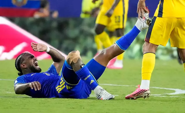Curaçao's Juergen Locadia grimaces during the World Cup Group E soccer match against Ecuador in Kansas City, Mo., Saturday, June 20, 2026. (AP Photo/Charlie Riedel)