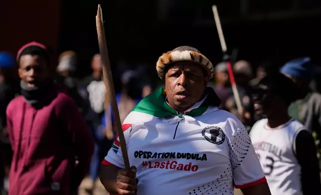 Protesters march against illegal immigration, in Johannesburg, South Africa, Tuesday, June 30, 2026. (AP Photo/Themba Hadebe)