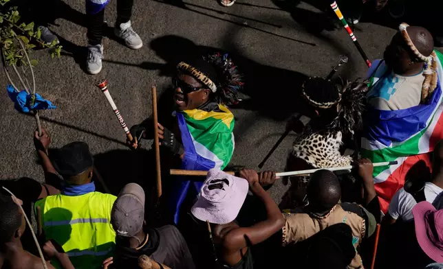 People attend a protest against illegal immigration, in Johannesburg, South Africa, Tuesday, June 30, 2026. (AP Photo/Themba Hadebe)