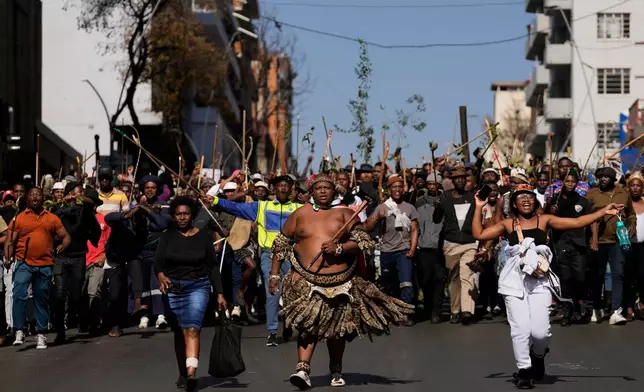 Protesters march against illegal immigration, in Johannesburg, South Africa, Tuesday, June 30, 2026. (AP Photo/Themba Hadebe)