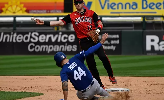 Chicago White Sox shortstop Colson Montgomery (12) forces Los Angeles Dodgers' Andy Pages out and throws to complete a double play during the fourth inning of a baseball game , Saturday, June 13, 2026, in Chicago. (AP Photo/Matt Marton)