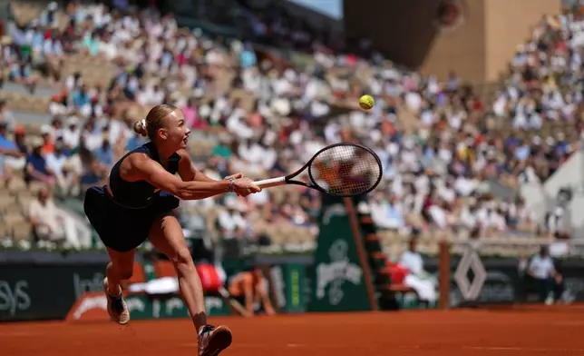 Austria's Anastasia Potapova returns to Russia's Anna Kalinskaya during the fourth-round tennis match at the French Open in Paris, Monday, June 1, 2026. (AP Photo/Thibault Camus)