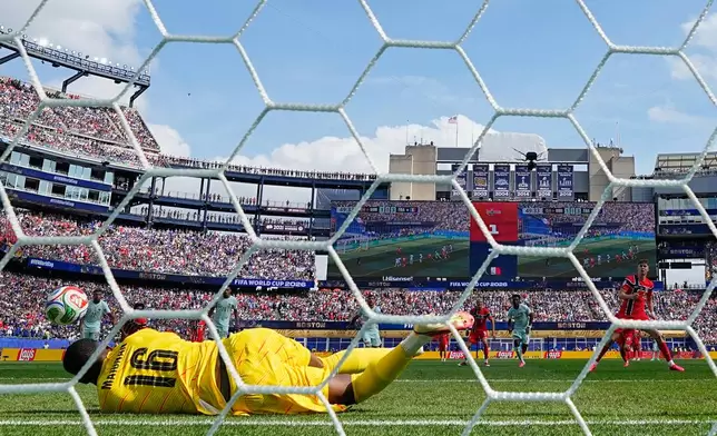 France goalkeeper Mike Maignan (16) saves a penalty from Norway's Joergen Strand Larsen (11) during the World Cup Group I soccer match between Norway and France in Foxborough, Mass., near Boston, Friday, June 26, 2026. (AP Photo/Martin Meissner)
