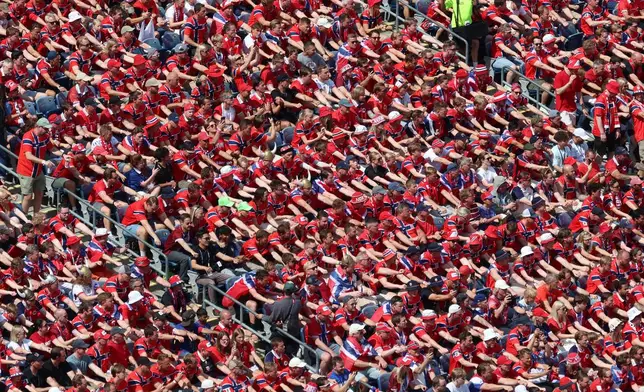 Norwegian fans perform a viking boat row during the World Cup Group I soccer match between Norway and France in Foxborough, Mass., near Boston, Friday, June 26, 2026. (AP Photo/Mark Stockwell)