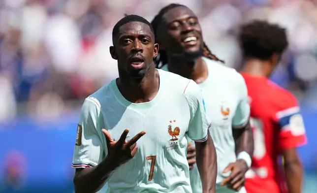 France's Ousmane Dembele celebrates after scoring his side's third goal during the World Cup Group I soccer match between Norway and France in Foxborough, Mass., near Boston, Friday, June 26, 2026. (AP Photo/Martin Meissner)
