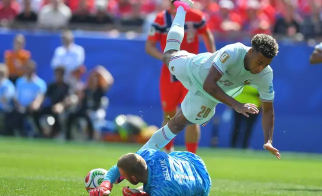 Norway goalkeeper Egil Selvik (13) makes a save against France's Desire Doue (20) during the World Cup Group I soccer match between Norway and France in Foxborough, Mass., near Boston, Friday, June 26, 2026. (AP Photo/Steven Senne)