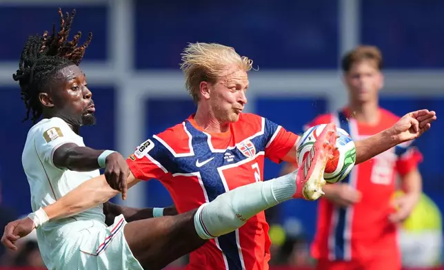 France's Manu Kone, left, vies for the ball with Norway's Morten Thorsby during the World Cup Group I soccer match between Norway and France in Foxborough, Mass., near Boston, Friday, June 26, 2026. (AP Photo/Martin Meissner)