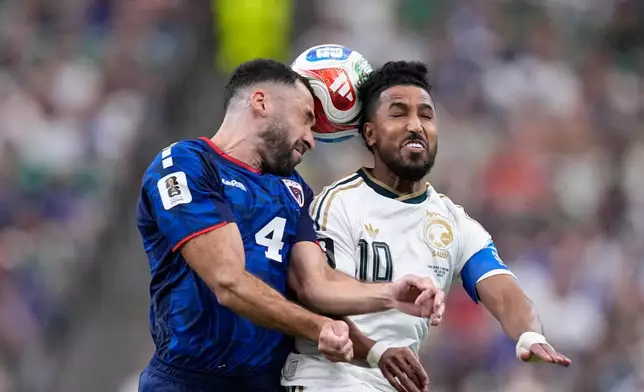 Saudi Arabia's Salem Aldawsari (10) battles for the ball with Cape Verde's Pico Lopes (4) during the World Cup Group H soccer match between Cape Verde and Saudi Arabia in Houston, Friday, June 26, 2026. (AP Photo/Ashley Landis)
