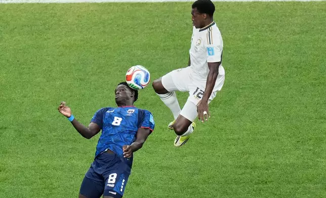 Saudi Arabia's Saud Abdulhamid (12) and Cape Verde's Joao Paulo (8) look to control the ball during the World Cup Group H soccer match between Cape Verde and Saudi Arabia in Houston, Friday, June 26, 2026. (AP Photo/Eric Gay)
