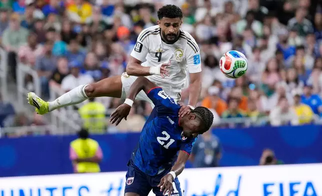 Saudi Arabia's Abdulelah Alamri (4) and Cape Verde's Nuno da Costa (21) collide was they try to head the ball during the second half of the World Cup Group H soccer match in Houston, Friday, June 26, 2026. (AP Photo/David J. Phillip)