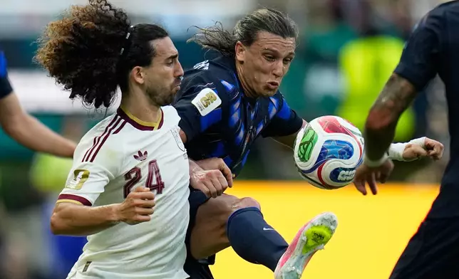 Spain's Marc Cucurella (24) challenges for the ball with Uruguay's Agustin Canobbio (14) during the World Cup Group H soccer match between Uruguay and Spain in Zapopan, near Guadalajara, Mexico, Friday, June 26, 2026. (AP Photo/Ricardo Mazalan)
