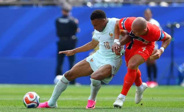 France's Kylian Mbappe (10) battles with Norway's Leo Oestigard (4) during the World Cup Group I soccer match between Norway and France in Foxborough, Mass., near Boston, Friday, June 26, 2026. (AP Photo/Steven Senne)